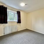 Empty room with window and radiator