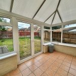 Modern conservatory with garden view.