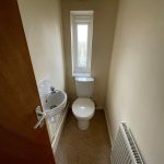 Small bathroom with toilet and sink.