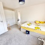 Bedroom with Pikachu themed bedding.