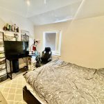 Cosy bedroom with desk and chair.