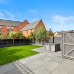 Modern garden with lawn and paved patio