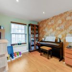 Cosy room with piano and wallpaper design