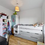 Children's room with bed and toys.