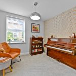 Stylish music room with piano and armchair