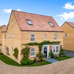 Modern two-storey brick house with garden