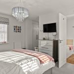 Modern bedroom with ensuite shower and chandelier lighting.