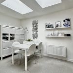 Modern white dining room with minimalist decor.