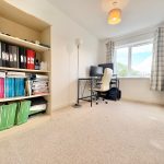 Home office with desk and bookshelf