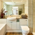 Modern bathroom with sink and shower.