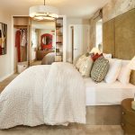 Elegant bedroom with modern decor and large bed.
