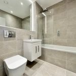 Modern bathroom with shower and bathtub.