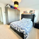Modern bedroom with wardrobe and double bed