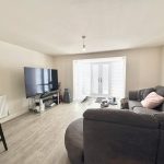 Modern living room with sofa and large TV