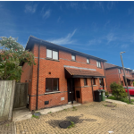 Red-brick semi-detached house with driveway and garden