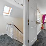 Bright hallway leading to a bedroom.