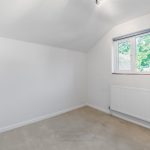 Empty room with window and radiator