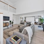 Modern open-plan living room with staircase