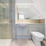 Modern bathroom with shower, sink, and toilet