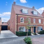 Newly built red brick houses for sale in neighbourhood.