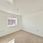 Bright empty room with carpet and large window