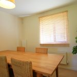 Dining room with wooden table and chairs