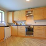 Modern kitchen with wood cabinets and appliances