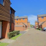 Brick houses on a sunny residential street