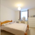 Bedroom with double bed and dressing table