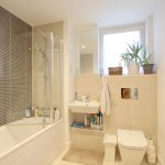 Modern bathroom with bathtub and plants