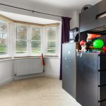 Children's bedroom with toys and bunk bed.