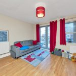 Living room with sofa and balcony view