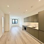 Modern open plan kitchen in a bright apartment.