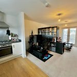 Modern open-plan kitchen and living room.