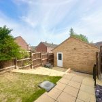 Backyard with patio and wooden fence