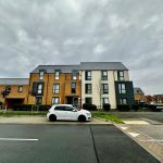 Modern residential building with cloudy sky