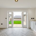 Modern kitchen with patio doors to garden