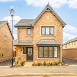 Modern two-storey brick house with driveway