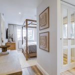 Modern bedroom with canopy bed and mirrored wardrobe