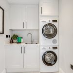 Modern laundry room with washer and dryer.