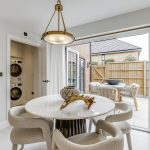 Modern dining room with table and outdoor view.