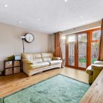 Cosy living room with sofas and garden view
