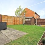 Back garden with shed and patio area.
