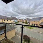 View of residential street from balcony.