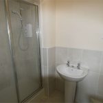 Modern bathroom with shower and basin