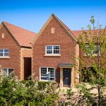 Newly built red brick houses in a row.