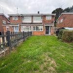 Semi-detached brick house with front garden