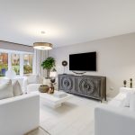 Modern living room with white sofas and TV