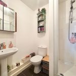 Small modern bathroom with shower and sink