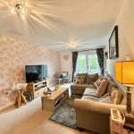 Cosy living room with sofa and large TV